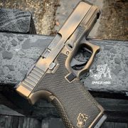 Glock 19 - G19 with distressed burnt bronze cerakote, laser engraving, stippling, undercut, and frame mods. best custom gun shop